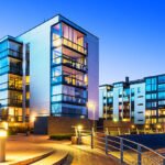 House building and city construction concept: evening outdoor urban view of modern real estate homes. See also: